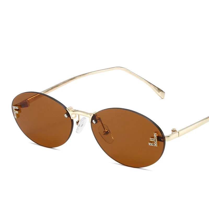 Óculos Diamond F Oval – Estilo Sofisticado com Armação Sem Aro e Detalhe Luxuoso